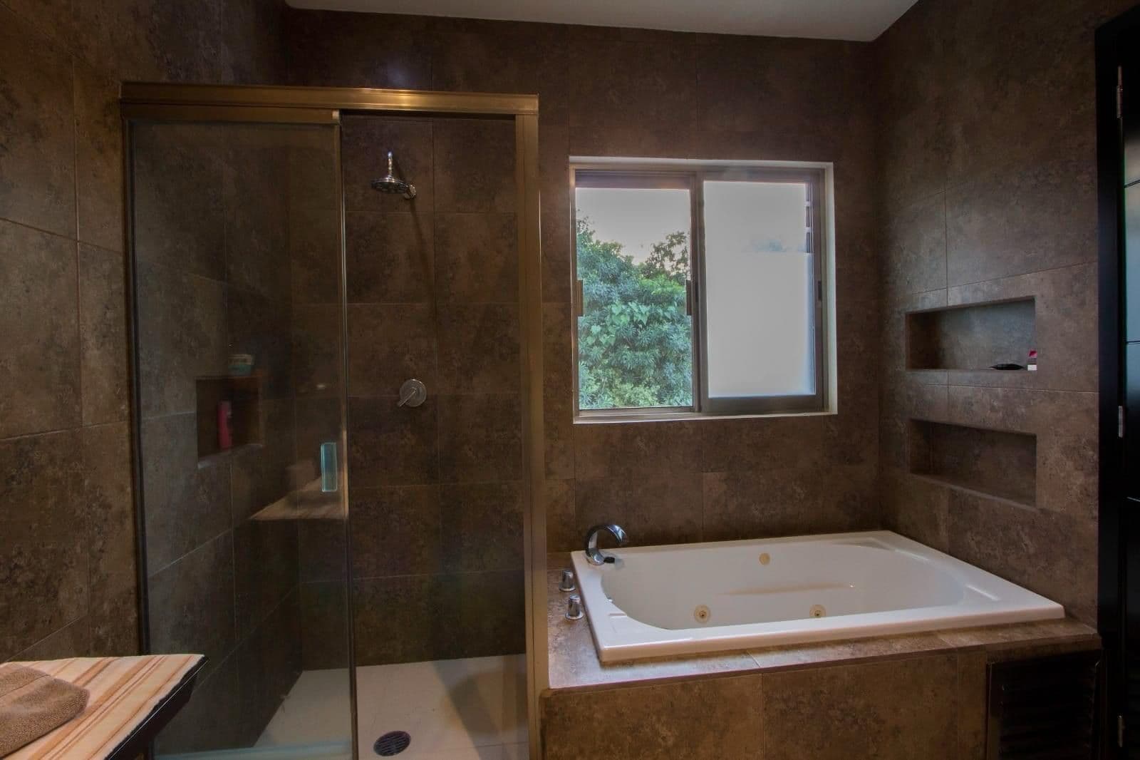 Spa-grade bathroom with jacuzzi tub at MindScape Retreat
