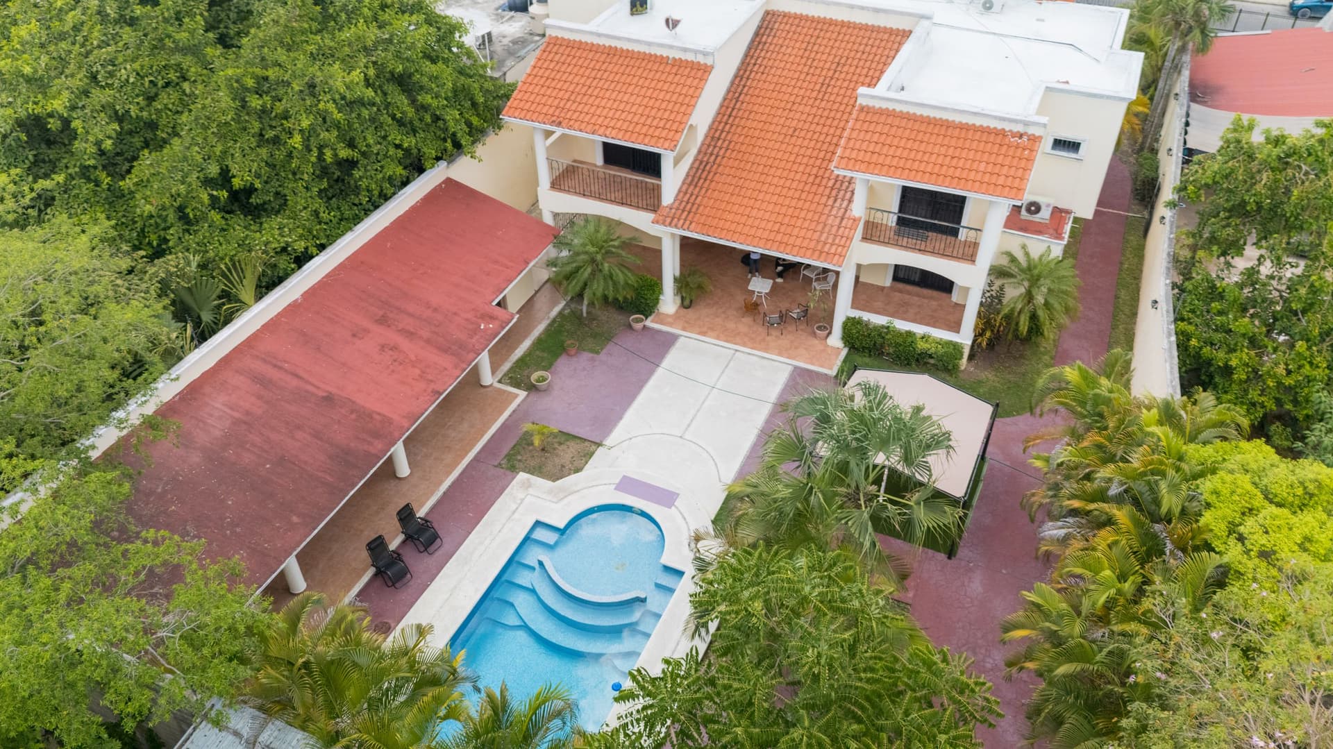 Aerial view of MindScape Retreat's private estate and pool in Cozumel