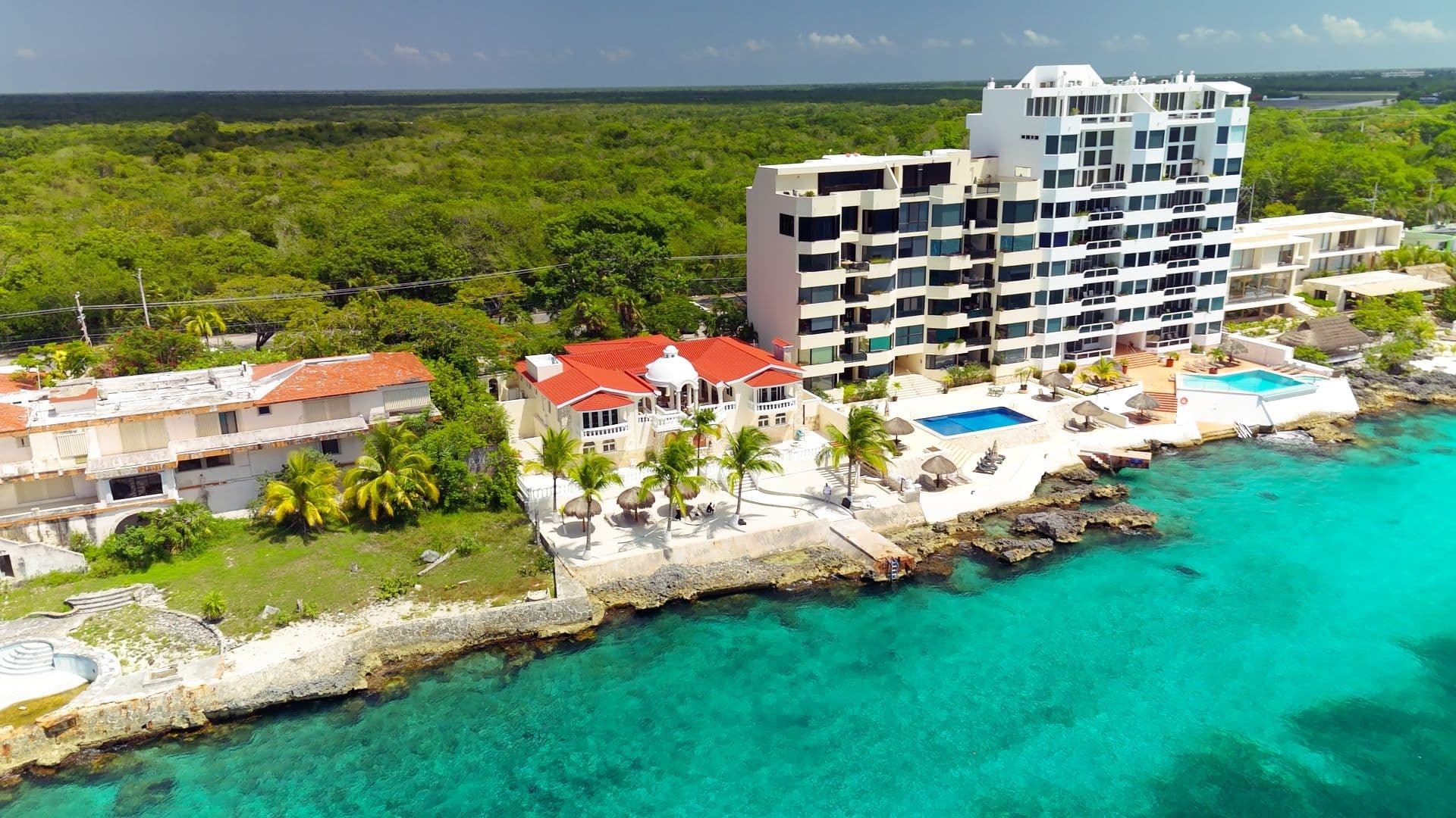 Aerial view of the Caribbean coastline at MindScape Retreat's oceanfront residence in Cozumel Mexico